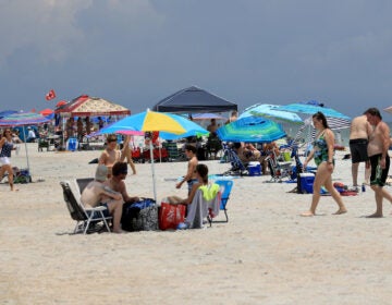 People visit Jacksonville Beach on Saturday in Jacksonville Beach, Florida. Coronavirus cases are spiking in states including Florida, Texas and Arizona.