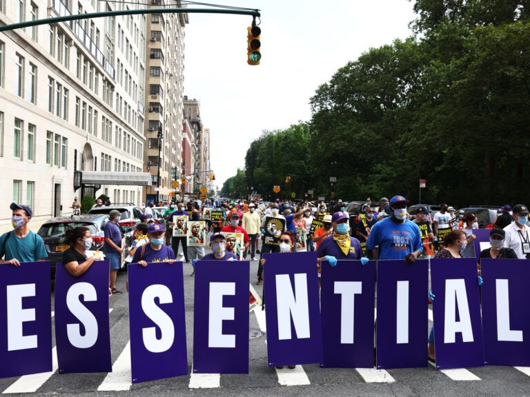 Members of the 32BJ union participate in a “Strike for Black Lives” rally in New York City, one of the many demonstrations for racial and economic justice that took place across the U.S. on Monday. Members of the 32BJ union participate in a