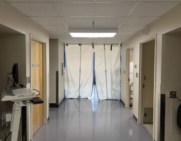 A hallway leads to a makeshift isolation ward for COVID-19 patients. (Kirk Siegler/NPR)