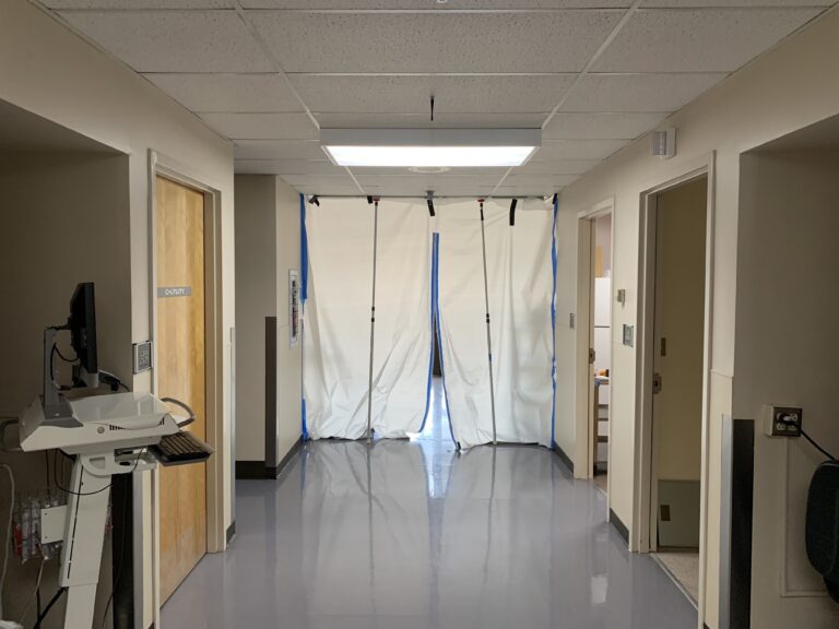 A hallway leads to a makeshift isolation ward for COVID-19 patients. (Kirk Siegler/NPR)