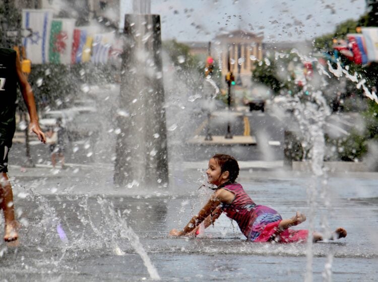 Kids cool off in the LOVE Park fountain
