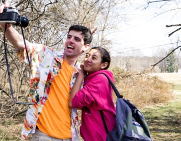 Two students posing for a photo in Episode 1, 