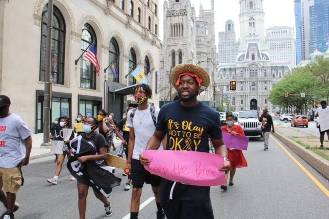 Protesters march from City Hall to Hunting Park in a rally against gun violence.