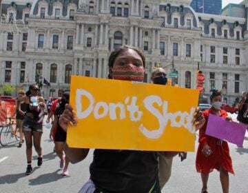 Sarai Ford marches with a group of young people calling for an end to gun violence on July 20, 2020. (Emma Lee/WHYY)