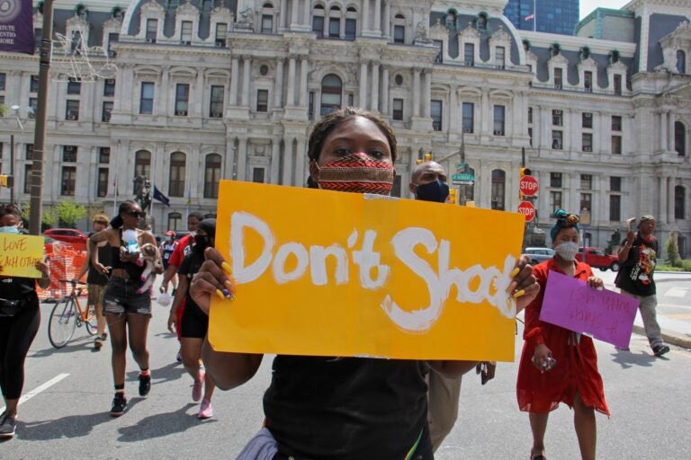 Sarai Ford marches with a group of young people calling for an end to gun violence on July 20, 2020. (Emma Lee/WHYY)