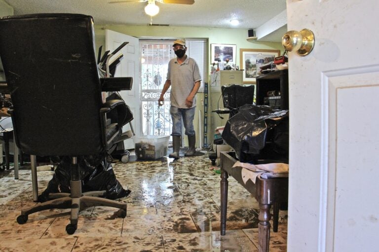 File photo: Flood water from Darby Creek rose to nearly four feet inside Leo Brundage's Eastwick home after Tropical Storm Isaias struck. (Emma Lee/WHYY)