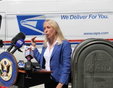 U.S. Rep. Mary Gay Scanlon joins federal, state and local officials at Second and Spring Garden streets to call for emergency funding for the struggling U.S. Postal Service. (Emma Lee/WHYY)