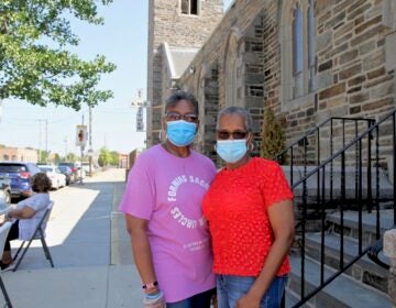 Lethonia Dennison and Beatrice Sims are ministers at St. Matthew AME Church, and have been giving out census information with free meals for those affected by COVID-19. (Ximena Conde/WHYY)