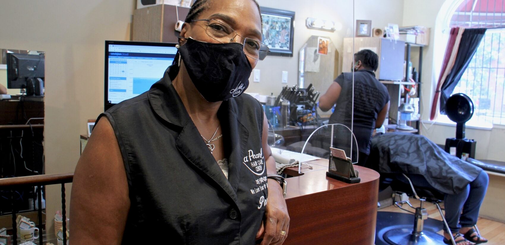 Pearl Bailey-Anderson owns La Pearl Beauty Emporium on Lancaster Avenue. (Emma Lee/WHYY)