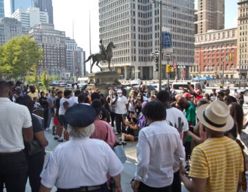 About 150 people gathered outside City Hall in Philadelphia for an anti-gun violence rally on Monday. (Kimberly Paynter/WHYY)