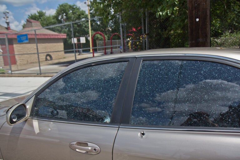 A bullet hole in a vehicle outside Clayborn and Lewis Playground in West Philadelphia. (Kimberly Paynter/WHYY)