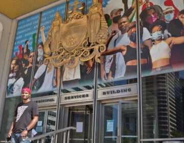 Mural artist Russell Craig included his own image in the crown-shaped collage of protesters now on Philadelphia’s Municipal Services building, behind where the statue of controversial Mayor Frank Rizzo stood until June. (Kimberly Paynter/WHYY)
