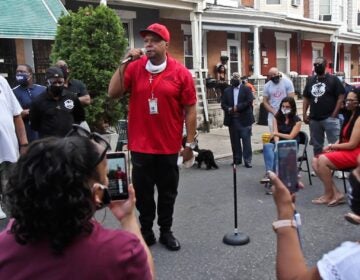 Colwin Williams with Cure Violence tells Simpson Street residents that officials are putting a bandaid on the problem and not dealing with real issues surrounding gun violence. An emergency meeting was called on August 6, 2020, after 7-year-old Zamar Jones was fatally shot. (Kimberly Paynter/WHYY)