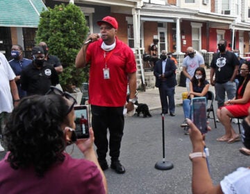 Colwin Williams with Cure Violence tells Simpson Street residents that officials are putting a Band-aid on the problem and not dealing with real issues surrounding gun violence. (Kimberly Paynter/WHYY)