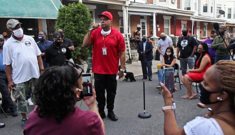 Colwin Williams with Cure Violence tells Simpson Street residents that officials are putting a Band-aid on the problem and not dealing with real issues surrounding gun violence. (Kimberly Paynter/WHYY)