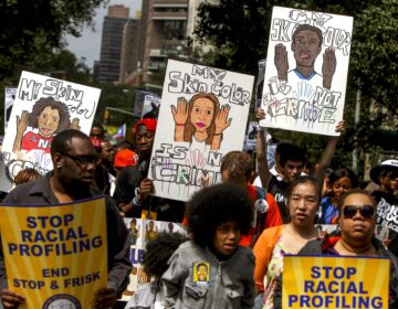 Protestors with signs during a silent march to end 'stop-and-frisk' program in New York. During the Bloomberg administration, civil rights groups went to court to end the NYPD's use of a tactic known as 'stop and frisk,' which involved detaining, questioning and sometimes searching people deemed suspicious by officers. Finding marijuana was often used to justify the policy. (AP Photo/Seth Wenig, File)