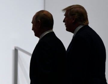 FILE - In this June 28, 2019, file photo, President Donald Trump and Russian President Vladimir Putin walk to participate in a group photo at the G20 summit in Osaka, Japan.  (AP Photo/Susan Walsh, File)