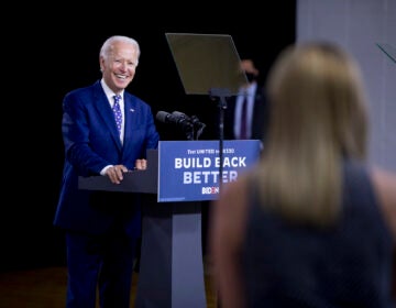 Democratic presidential candidate former Vice President Joe Biden smiles as he takes a question from a reporter at a campaign event at the William 