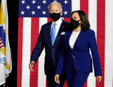 Democratic presidential candidate former Vice President Joe Biden and his running mate Sen. Kamala Harris, D-Calif., arrive to speak at a news conference at Alexis Dupont High School in Wilmington, Del., Wednesday, Aug. 12, 2020. (AP Photo/Carolyn Kaster)