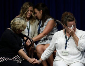 FILE - In this Aug. 14, 2018, file photo, victims of clergy sexual abuse, or their family members, react as Pennsylvania Attorney General Josh Shapiro speaks during a news conference at the State Capitol in Harrisburg, Pa. Pennsylvania Roman Catholic dioceses are facing recent lawsuits from people hoping a court decision in 2019 has shown a way around time limits for filing litigation. (AP Photo/Matt Rourke, File)