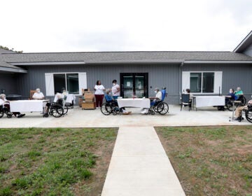 Residents at the Southern Pines nursing home are separated and wear face coverings during their daily bingo game in Warner Robins, Ga., on Thursday, June 25, 2020. “We’re going to have to run different for a long while,” says administrator Donna Stefano. “Otherwise it’s going to come back and next time we may not be so lucky.” (AP Photo/John Bazemore)