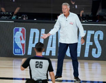 Philadelphia 76ers head coach Brett Brown looks to an official during the first half of an NBA basketball first round playoff game against the Boston Celtics Monday, Aug. 17, 2020, in Lake Buena Vista, Fla. (AP Photo/Ashley Landis, Pool)