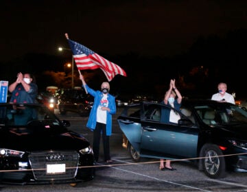 Supporters watch Democratic presidential candidate former Vice President Joe Biden speak, during the final day of the Democratic National Convention, Thursday, Aug. 20, 2020, on a screen at a drive-in theater watch party during the final night of the Democratic National Convention, Thursday, Aug. 20, 2020, in Washington.  (AP Photo/Luis M. Alvarez)