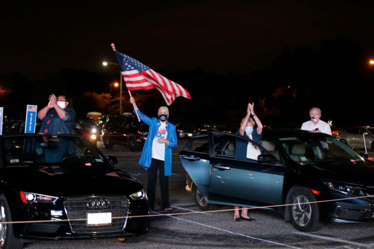 Supporters watch Democratic presidential candidate former Vice President Joe Biden speak, during the final day of the Democratic National Convention, Thursday, Aug. 20, 2020, on a screen at a drive-in theater watch party during the final night of the Democratic National Convention, Thursday, Aug. 20, 2020, in Washington.  (AP Photo/Luis M. Alvarez)