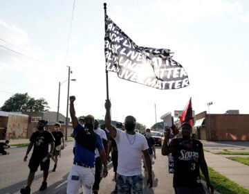 Protesters prepare to march against the police shooting of Jacob Blake, Thursday, Aug. 27, 2020, in Kenosha, Wis. (AP Photo/Morry Gash)