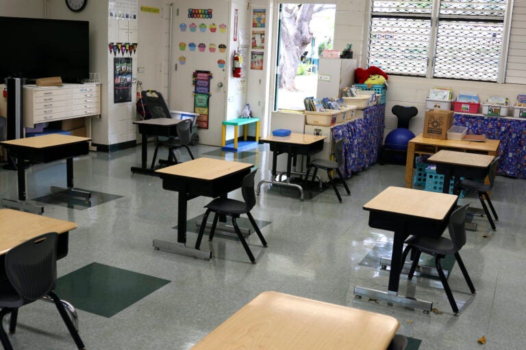 Desks are spaced out in a classroom