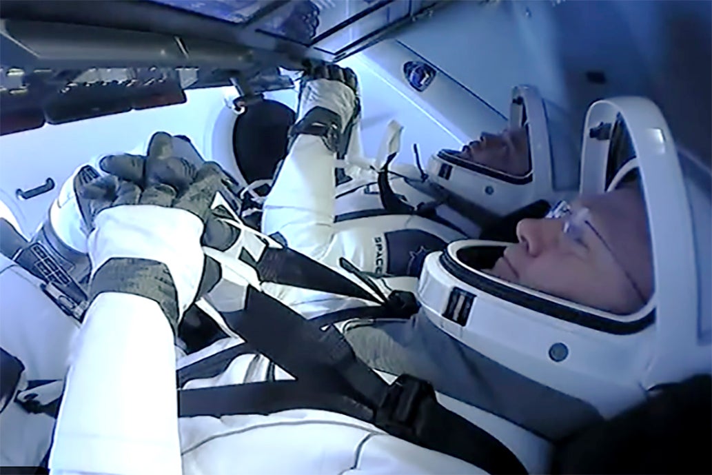 Astronauts Doug Hurley and Bob Behnken prepare to return to earth on a SpaceX capsule