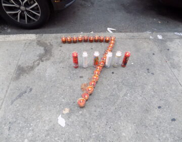 Zamar Jones' neighbors placed candles, balloons, and roses in front of his home in early August. (Ximena Conde/WHYY)