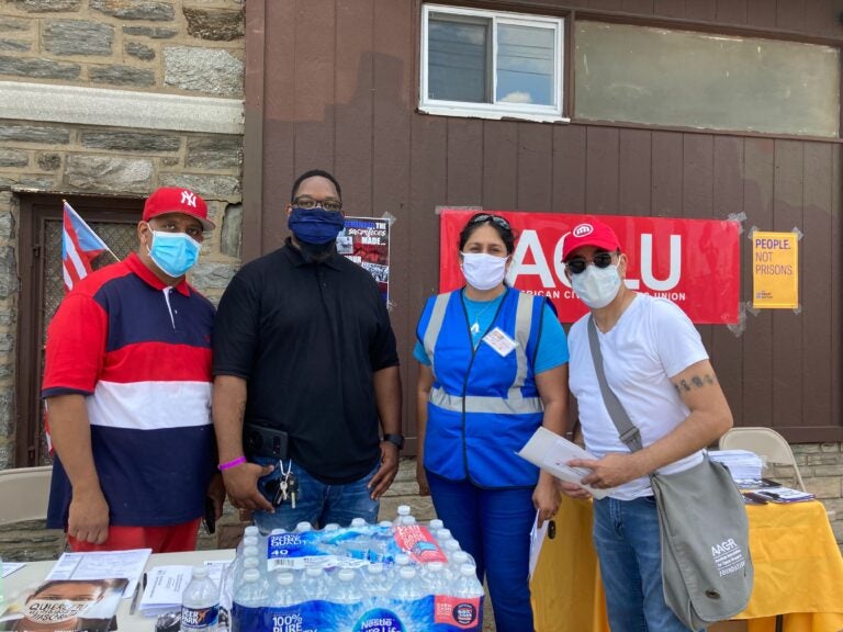 Organizers from several groups outside a church in North Philadelphia for a voter outreach event targeting Puerto Rican residents, immigrants, and formerly incarcerated individuals to give them information on voting rights. (Zachariah Hughes/WHYY)