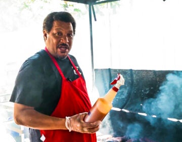 Pitmaster Terrell Barkley cooking at a barbeque