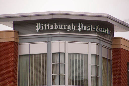 A sign on a building marks the offices of the Pittsburgh Post-Gazette on Thursday, Feb. 14, 2019, in Pittsburgh. The Newspaper Guild of Pittsburgh submitted a charge to the National Labor Relations Board on Wednesday that publisher and editor-in-chief John Robinson Block 