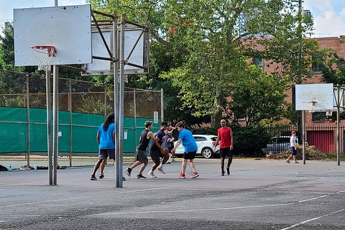 A group of friends plays basketball in South Philadelphia