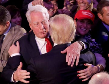 Republican president-elect Donald Trump hugs his brother Robert Trump