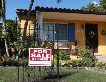 A sale sign is seen in front of a home in Miami. FHA loans are used by many minority, lower-income, and first-time homebuyers because the low down payments make homeownership more affordable. But this demographic is more likely to be hurt financially during the pandemic, and many FHA borrowers are skipping mortgage payments. (Joe Raedle/Getty Images)