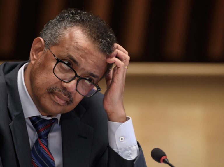 World Health Organization Director-General Tedros Adhanom Ghebreyesus at a news conference last month in Geneva. He is urging countries to join a pact aimed at ensuring access to drugs to prevent COVID-19. (Fabrice  Coffrini/Pool/AFP via Getty Images)