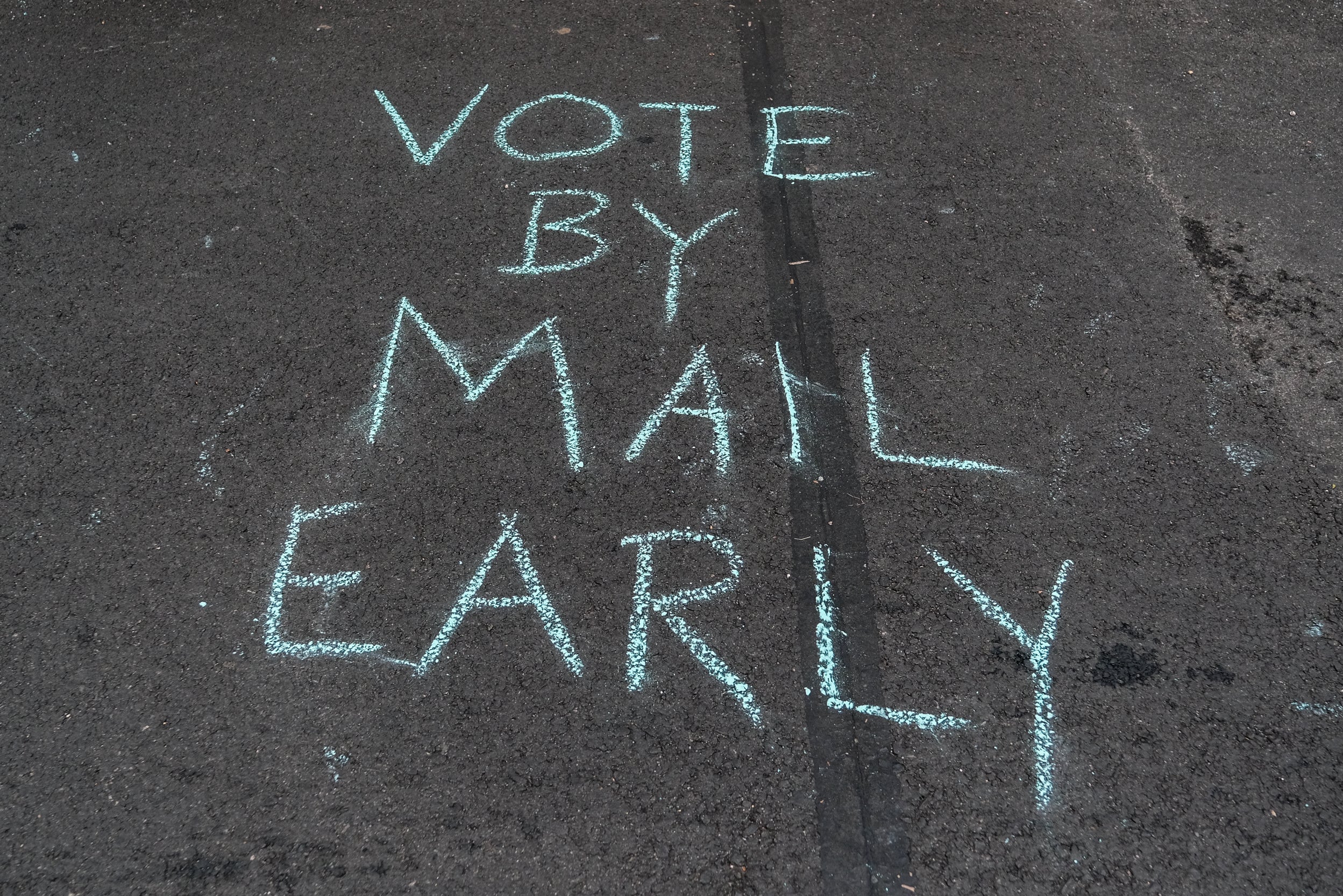 A message was left on the street outside of the condo of U.S. Postmaster General Louis Dejoy on Saturday in Washington, D.C.