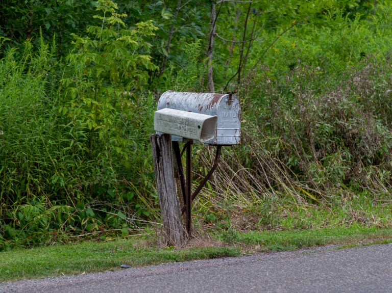 The U.S. Postal Service warned states in late July that it might not be able to deliver mail-in ballots in time to be counted. Amid a growing outcry from rural leaders, the agency's director has backed down from planned broad cuts and changes. (Paul Weaver/Pacific Press/LightRocket via Getty Images)