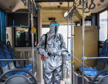 A worker disinfects the inside of a bus in Addis Ababa, Ethiopia. Transit agencies are taking new steps to reduce the risks for riders during the pandemic. (Michael Tewelde/Xinhua News Agency via Getty Images)