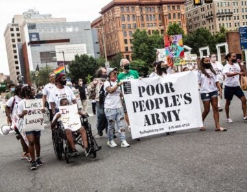 About 50 protesters marched against inequity in Center City Monday.