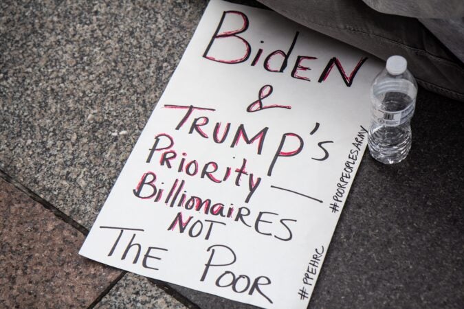 Protesters fighting for better schools, healthcare and against politicians serving corporate interests gathered outside Joe Biden’s Philadelphia headquarters Monday. (Kimberly Paynter/WHYY)