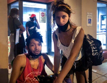 Justin Zimmerman and Hannah Kliokis outside the PPA impound lot in South Philadelphia (Max Marin / Billy Penn)