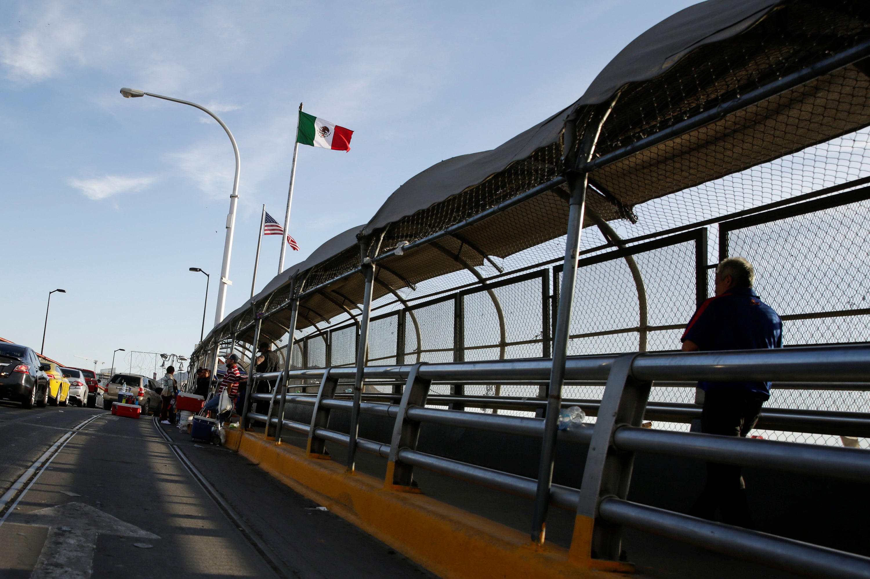 A man crosses the Paso del Norte border bridge towards El Paso, Texas, as seen from Ciudad Juarez, Mexico on July 1. Since March, U.S. immigration officials have turned away tens of thousands of migrants, including asylum seekers and unaccompanied children.