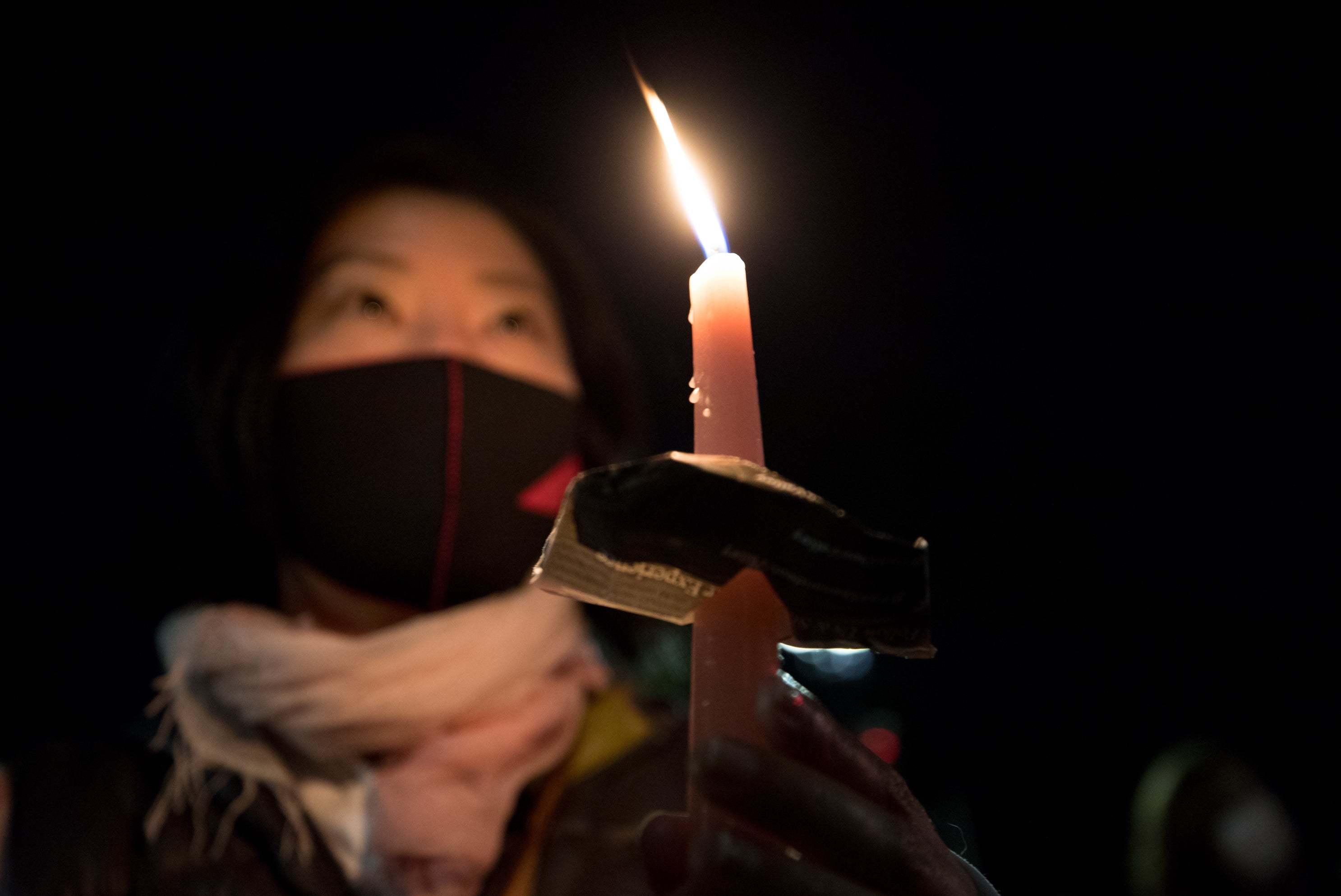 Saori Ishida holds a candle during a vigil for Ruth Bader Ginsburg.