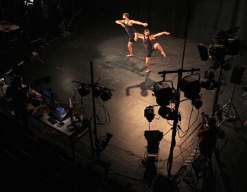 View of dancers in the spotlight on stage from above