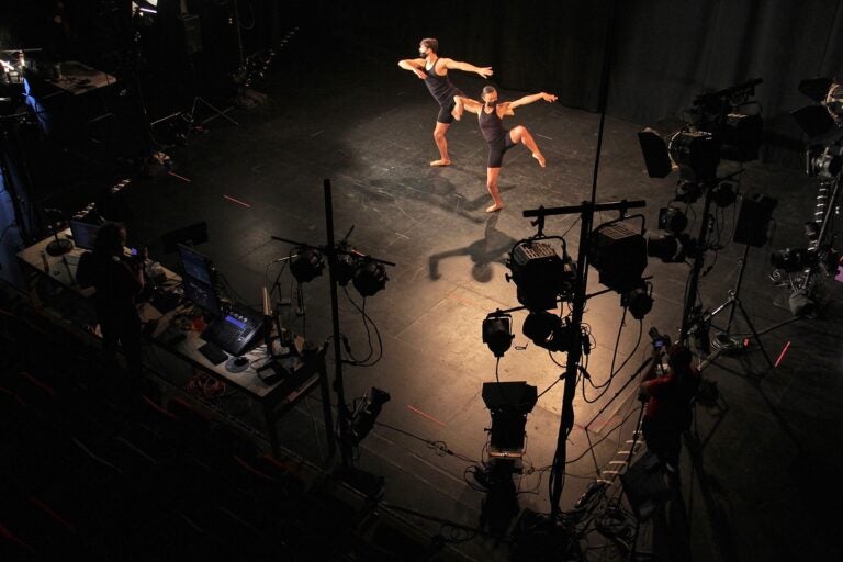 View of dancers in the spotlight on stage from above