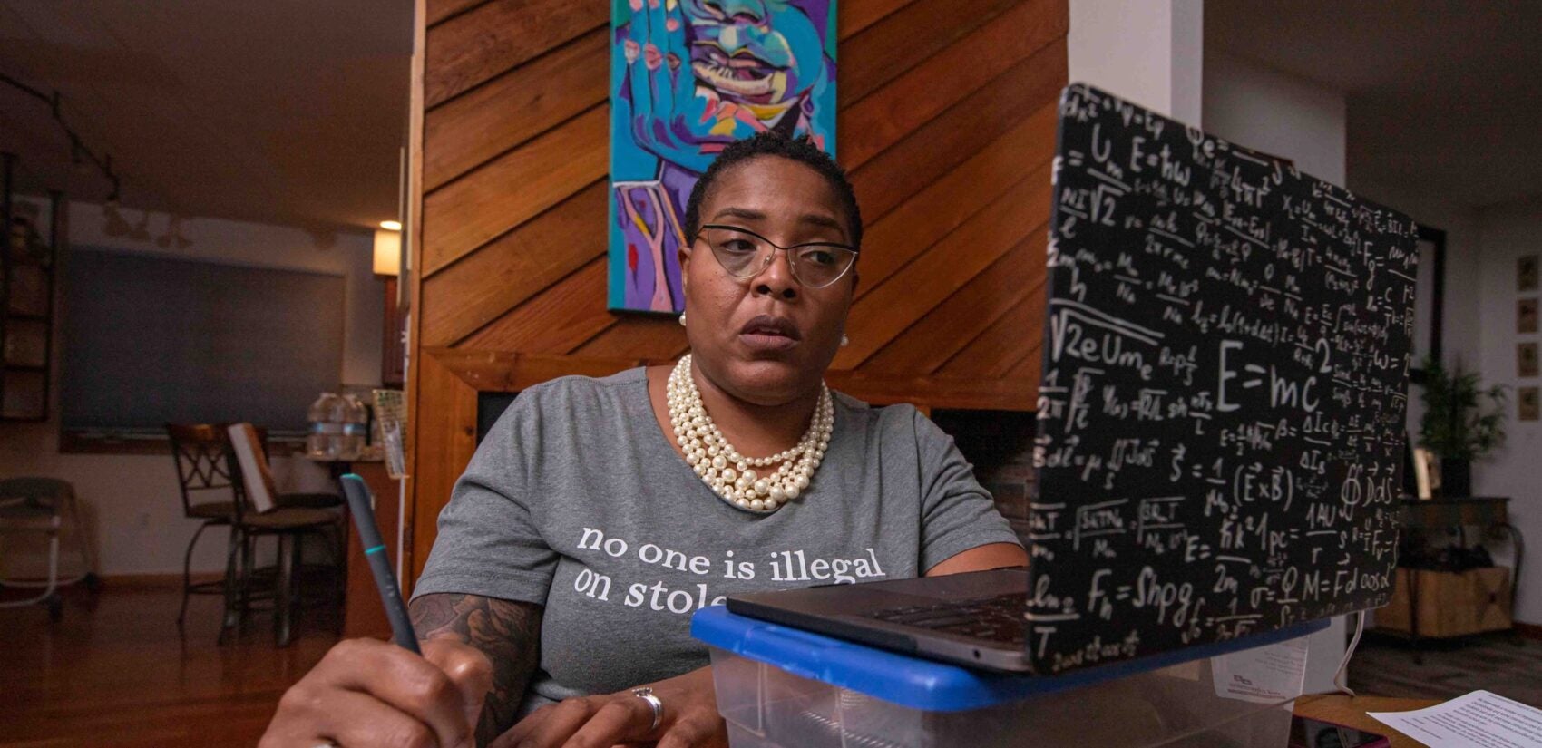 William D. Kelley School Principal Crystal Edwards takes notes during a Zoom meeting with her faculty on Tuesday, Sept. 1, 2020, at her home in Newark, Delaware.(Saquan Stimpson for WHYY)